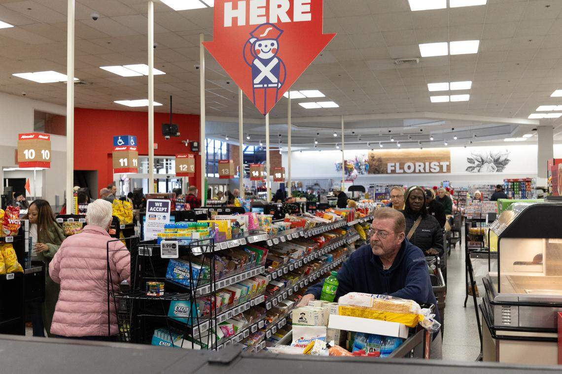 Shoppers lineup in Schnucks in Swansea on Friday. They were buying groceries ahead of a winter storm expected to hit early Sunday.