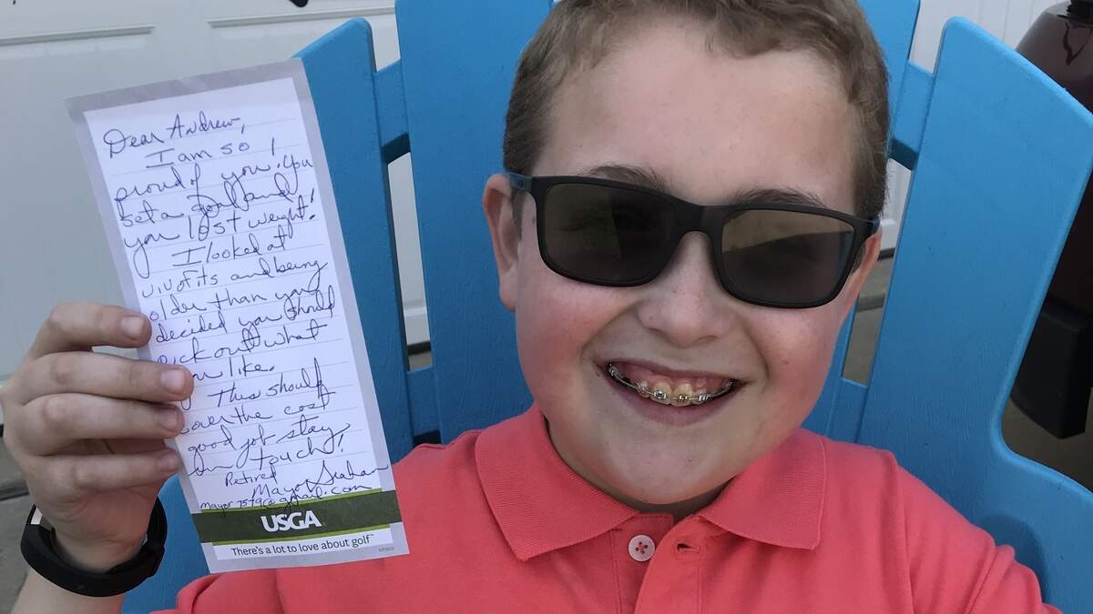 Andy Ord, 13, holds up a letter from former O'Fallon Mayor Gary Graham, who moved to Florida since leaving his post as the town's leader last year. When Andy was 'Mayor For A Day' last year on April 17, 2017, Graham struck a deal with the teen that if he lost 10 pounds in a year's time he would buy him a FitBit. The note was sent to Andy via the mail postmarked April 14, 2018 accompanied by an $80 check for his new FitBit step tracker watch.