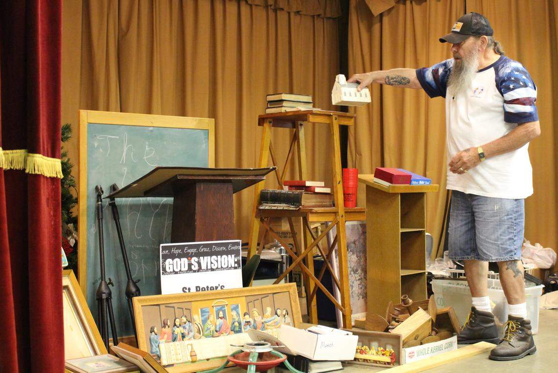 Wesley Doolittle, a longtime member of St. Peter Evangelical United Church of Christ in Granite City, sorts through inventory in the fellowship hall. The church is closing in August after 118 years.