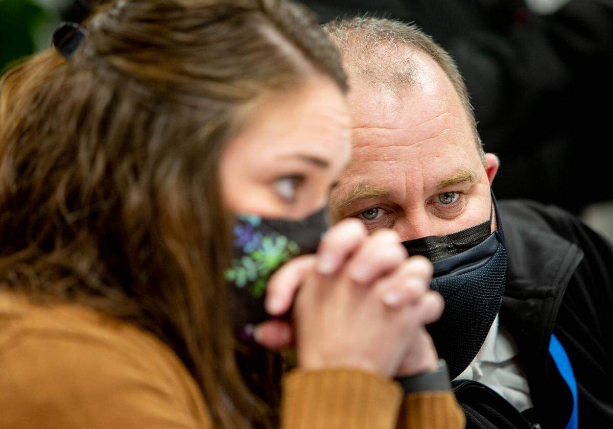Dorris Intermediate School principal Kevin Stirnaman leans in to speak to Caseyville Elementary principal Chelsea Clark Monday during a school board meeting at the CUSD 10 Administration Building.