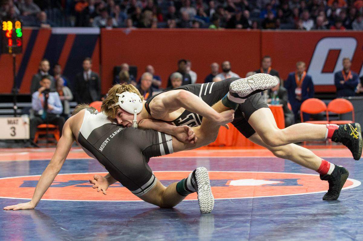 Belleville West’s Josh Koderhandt wrestles Mt. Carmel’s Colton Drousias during their 113-pound championship match at the Illinois High School Association Individual Wrestling State Finals. (Photo: PhotoNews/Chris Johns)