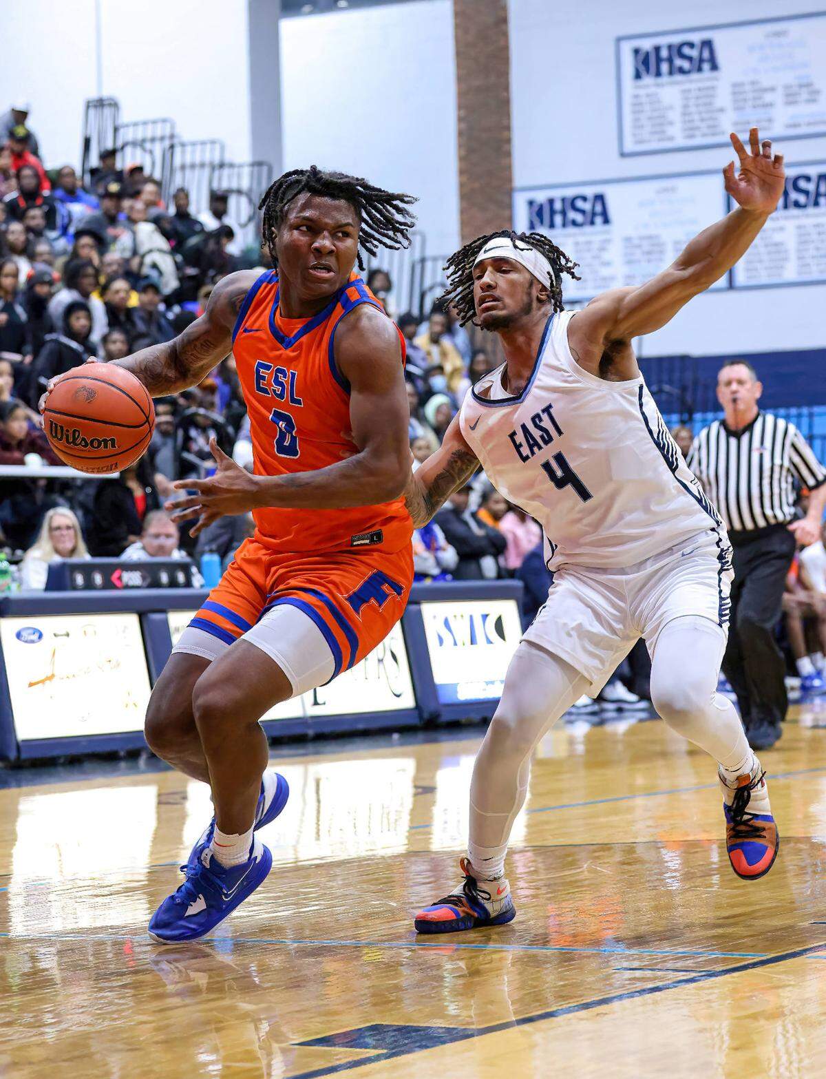 East St. Louis’ Macaleab Rich drives around Belleville East’s Darien Singleton during a Southwestern Conference game earlier this season. The Flyers defeated Triad on Friday night in the IHSA Class 3A Centralia Sectional championship to advance to the Springfield Super-Sectional.