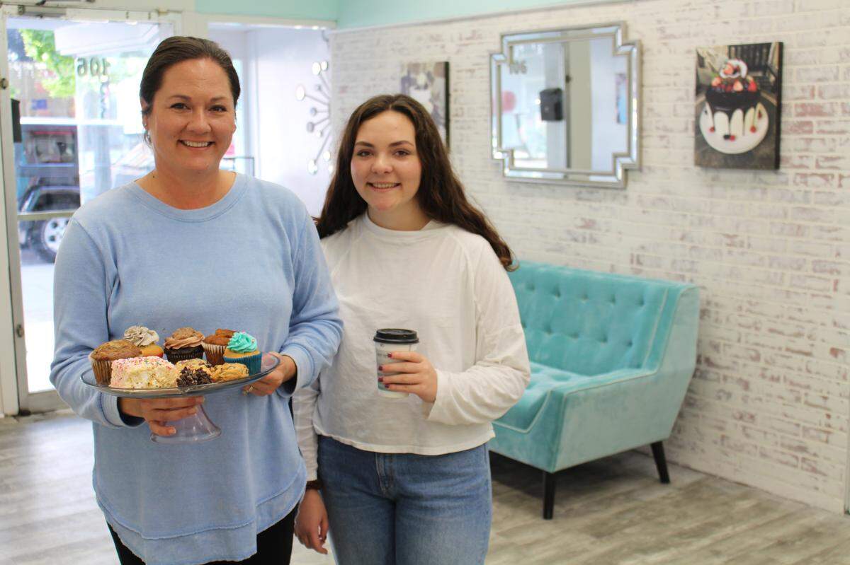 Rebecca Waterkotte, left, is the owner of Sugar Fix Bakery in downtown Belleville. Her daughter, Taylor, 18, helped on opening day Friday by waiting on customers and running the cash register.
