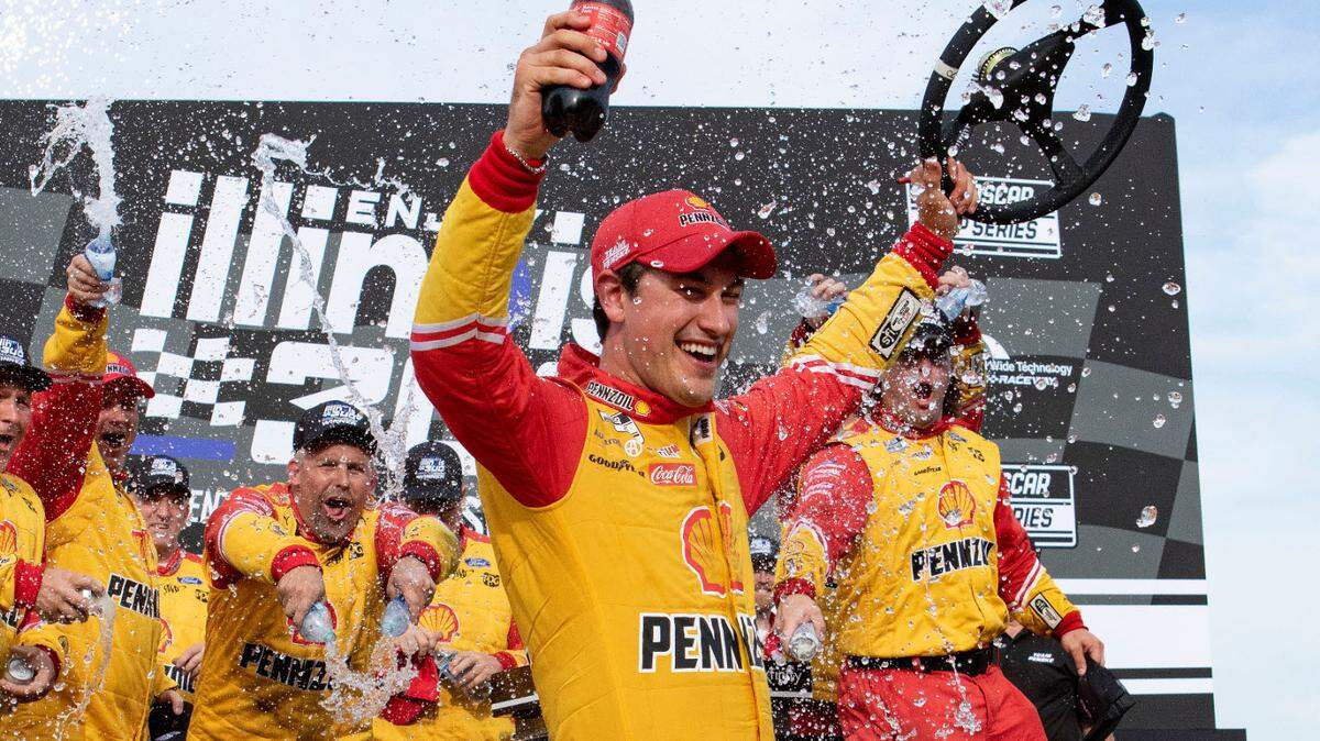Joey Logano celebrates in victory lane after winning the the Enjoy Illinois 300 at World Wide Technology Raceway in Madison.