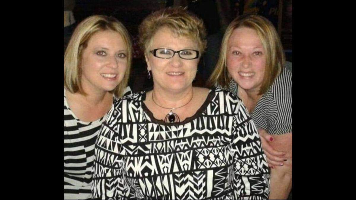 Norma Caraker, center, is shown with her two daughters, Andrea Hall, left, and Jenny Hosler, before her 2023 death. Their brother, Neil Howard, was accused of strangling her. Hall testified in his defense at trial.