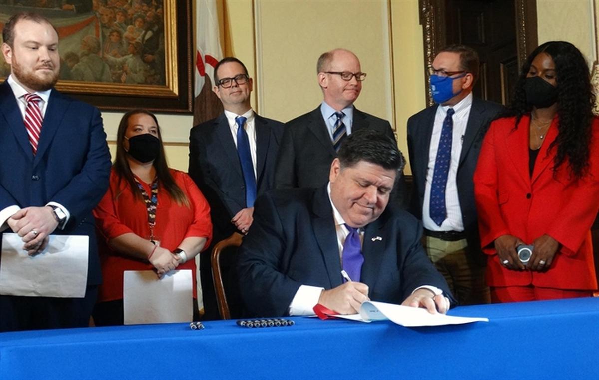 Gov. J.B. Pritzker signs a bill on Tuesday entitling public school, community college and public university employees who are fully vaccinated against COVID-19 to receive paid administrative leave for any days they miss this school year due to coronavirus-related issues.