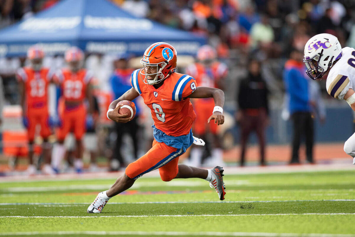 September 3, 2022 - East St. Louis, IL - East St. Louis quarterback Robert Battle carries the ball during the annual Gateway Scholars Football Classic football game between CBC and East St. Louis. [Photo: Chris Johns]