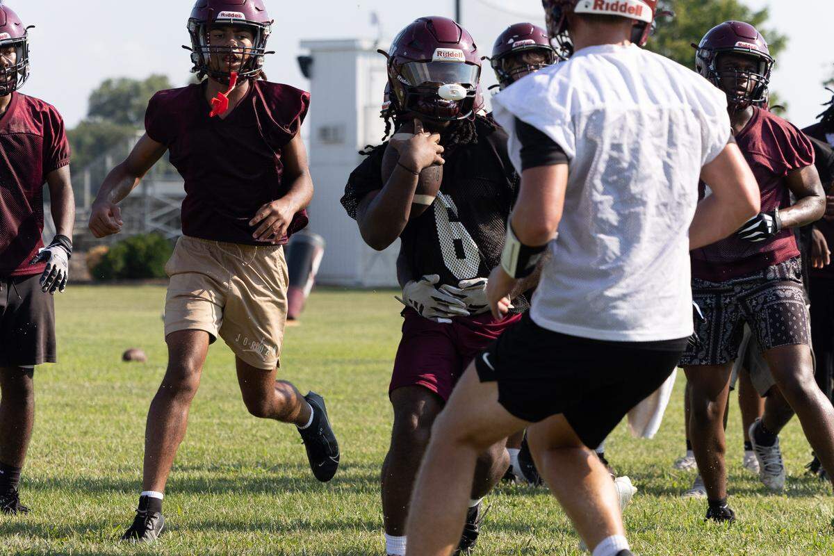 Belleville West Maroons run drills in preparation for the first game of the season.