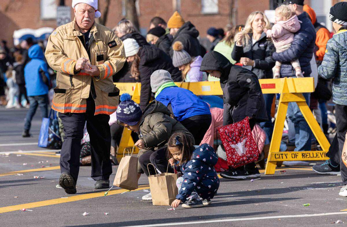 Children picking up candy during the Santa Parade.