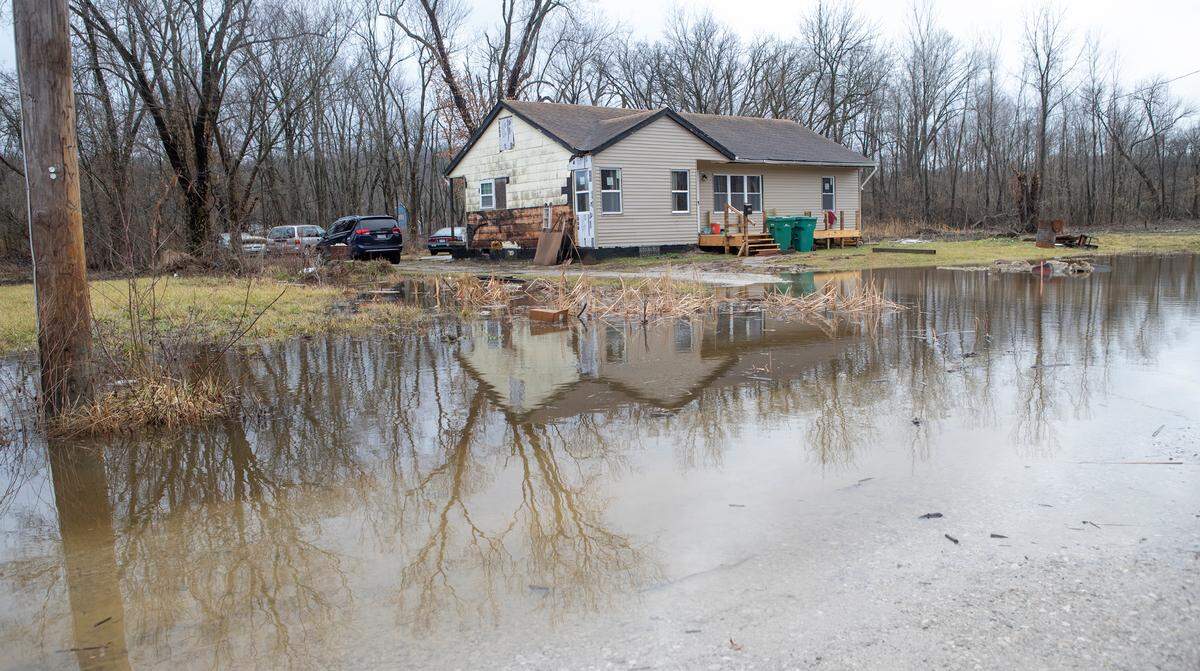 A ditch in front of a home on North 80th Street in Cahokia Heights was overflowing the morning of Jan. 3, 2023, after recent rainfall.