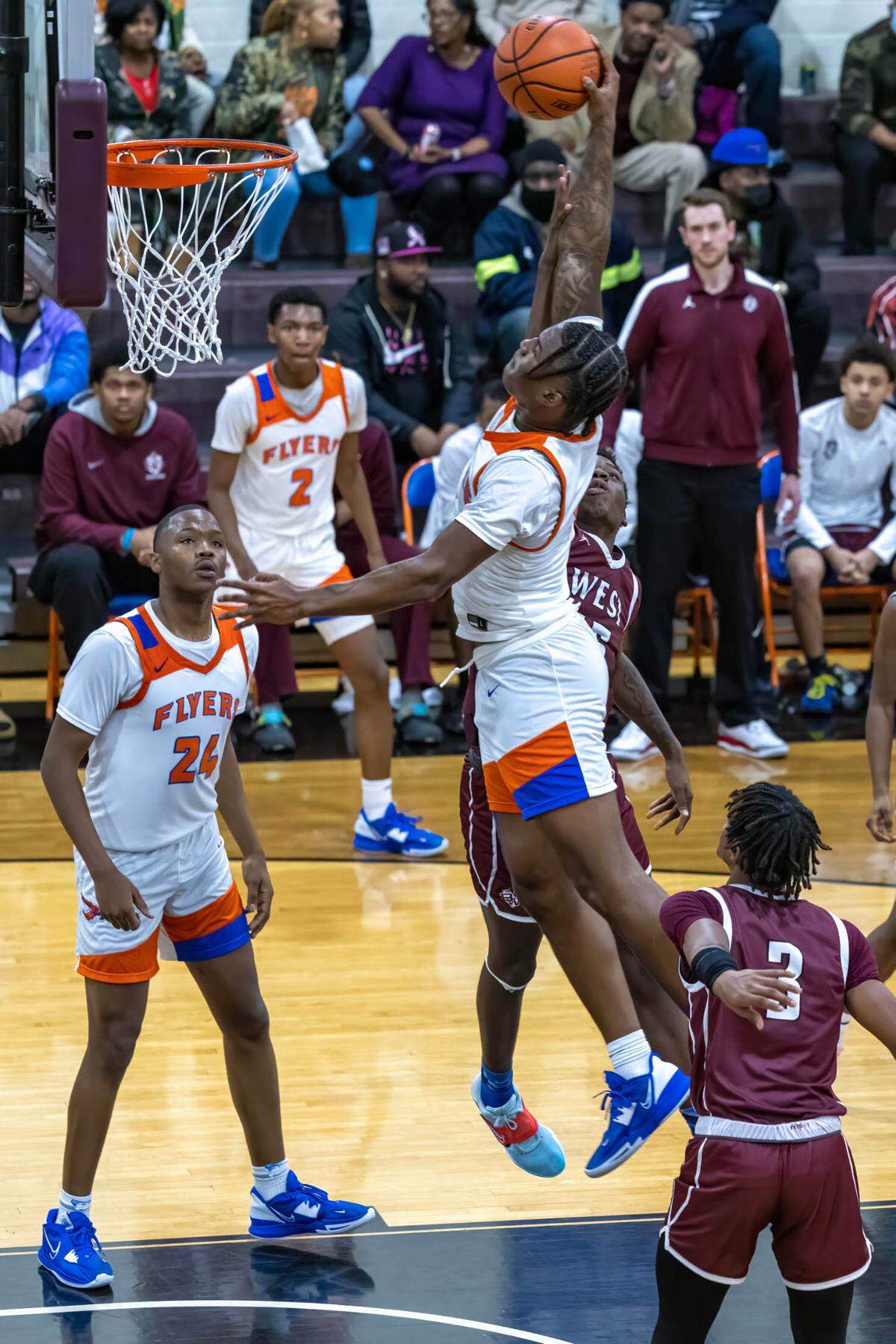 East St. Louis’ Macaleab Rich goes up for a dunk against Belleville West during Friday night’s Southwestern Conference game. The Flyers ultimately posted an 81-52 victory.