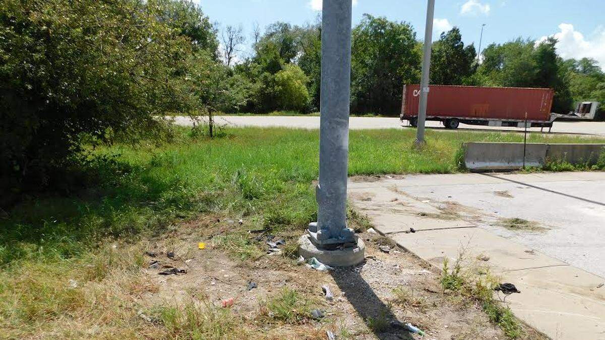 A car crashed into this light pole on a state weigh station Sunday morning, nearly cutting the car in half and killing a 45-year-old Mt. Vernon man. Police are investigating.