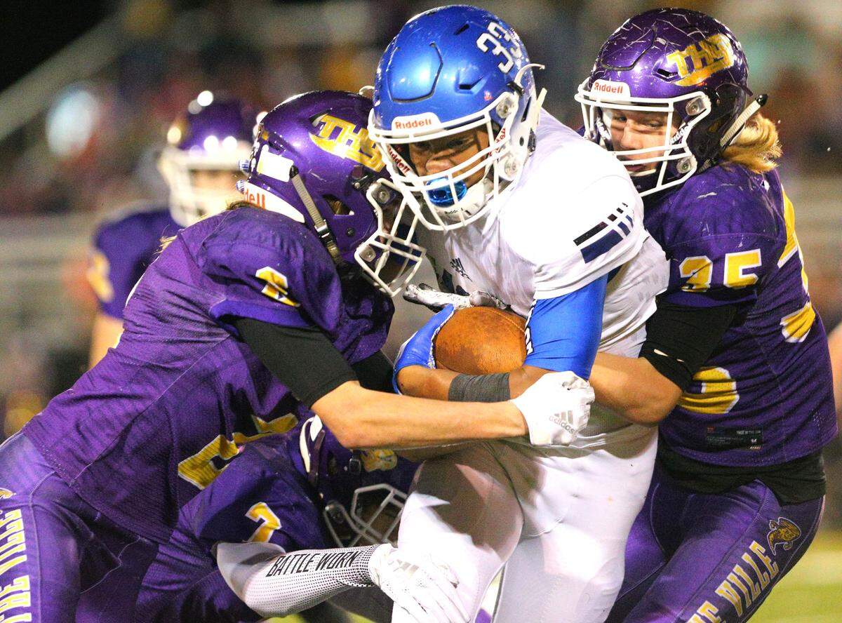 Columbia’s Donavan Bieber carries the ball during the second round IHSA Class 4A playoff game between Columbia and Taylorville Saturday in Taylorville.