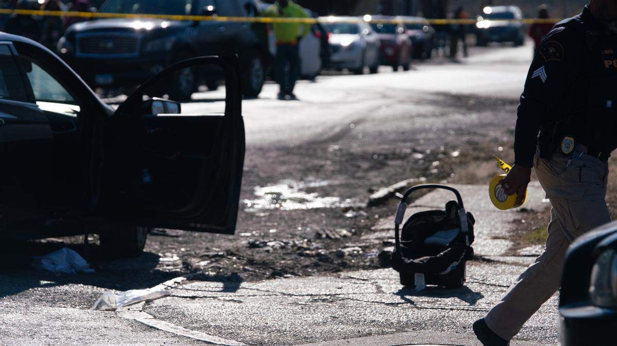 At the scene of a shooting near 10th Street and Bond Avenue in East St. Louis on Feb. 6, 2024. Two adults were shot. A 5-month-old boy was not struck by gunfire.