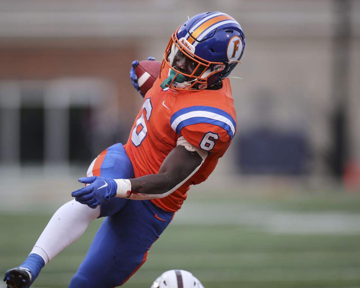 East St. Louis running back TaRyan Martin carries the ball during the IHSA Class 6A state championship game against Prairie Ridge.