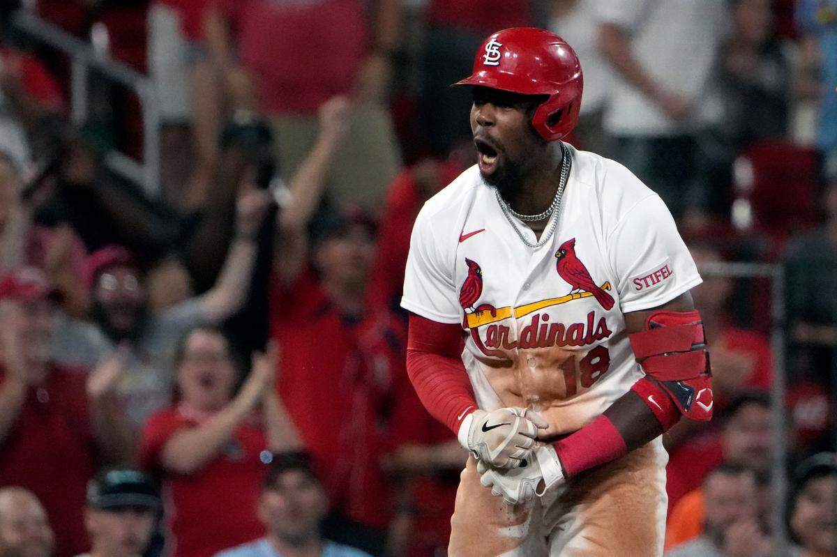St. Louis Cardinals’ Jordan Walker celebrates after hitting a three-run triple during the seventh inning of a baseball game against the Oakland Athletics Monday, Aug. 14, 2023, in St. Louis. (AP Photo/Jeff Roberson)