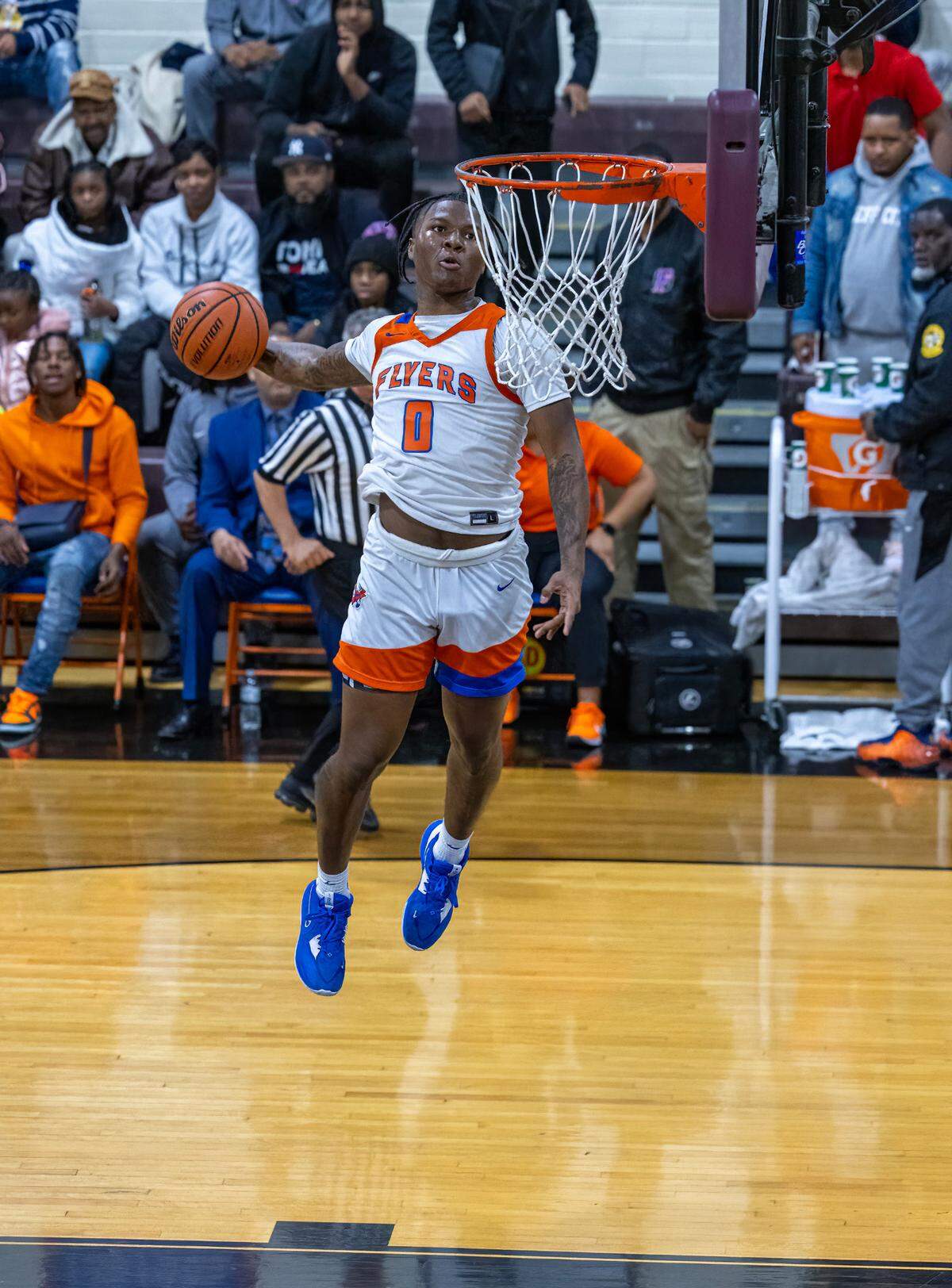 East St. Louis’ Macaleab Rich goes up for a dunk against Belleville West during Friday night’s Southwestern Conference game. The Flyers ultimately posted an 81-52 victory.