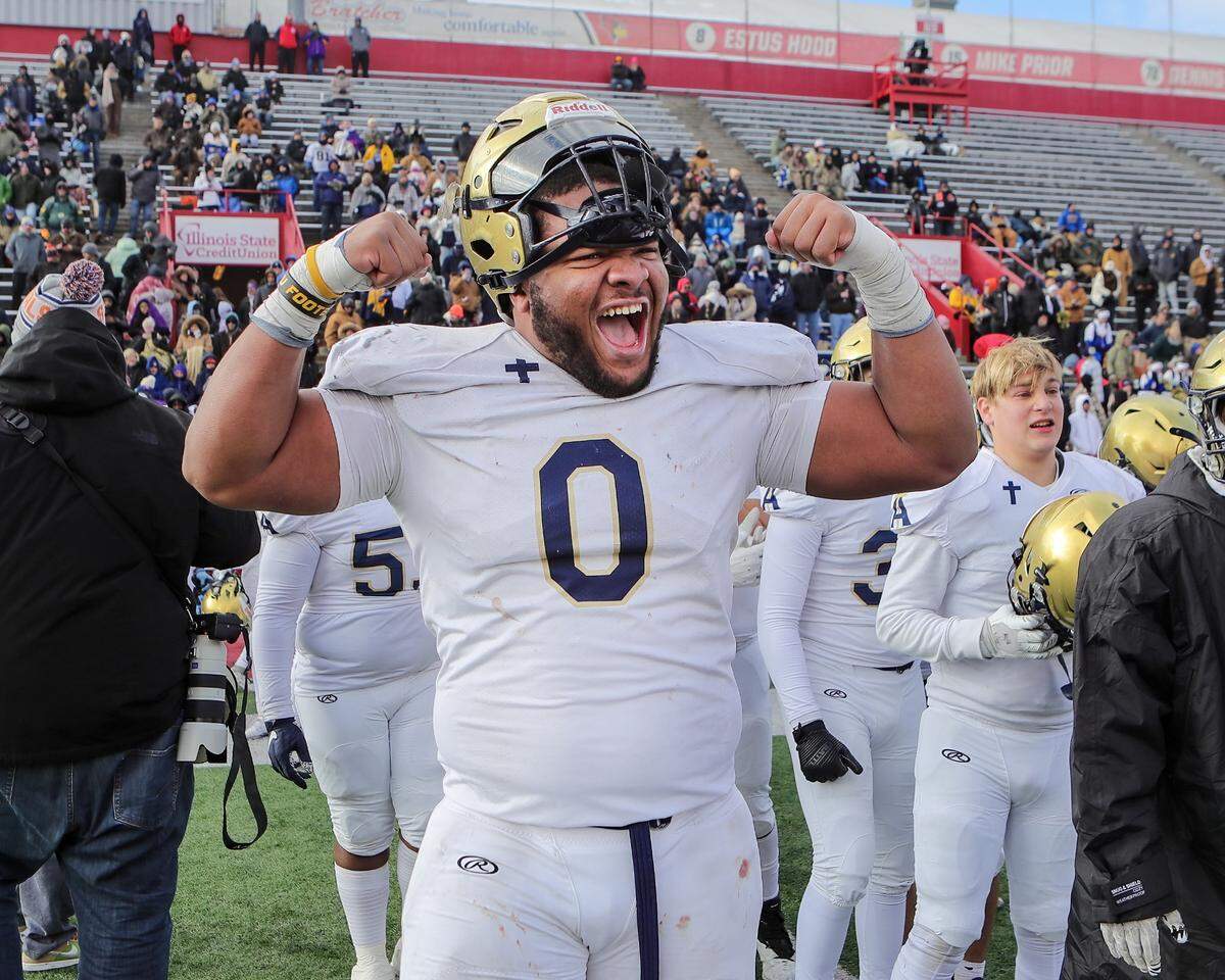 Althoff’s Jason Dowell celebrates the Crusaders’ 57-14 win over Lena-Winslow for the IHSA Class 1A title at Hancock Stadium on the campus of the Illinois State University.