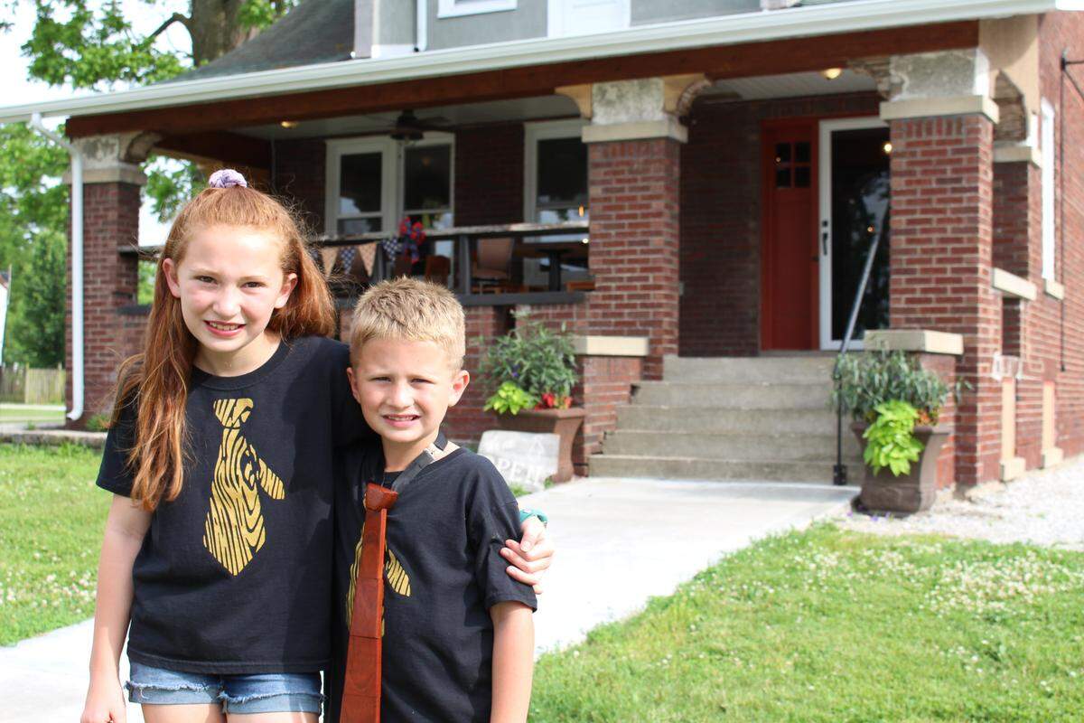 Emma Jackson, 9, left, and her brother, Tommy, 7, help out at the Wooden Tie Cafe in Pierron whenever possible. The restaurant and bar is operated by their parents, uncle and grandparents.