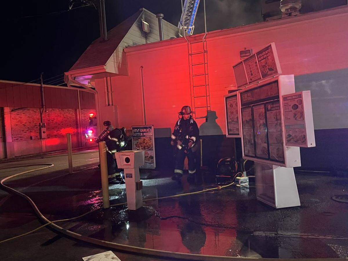 Firefighters are shown in the drive-thru area of Captain D’s restaurant in Fairview Heights on Saturday morning, when the building was damaged by fire.