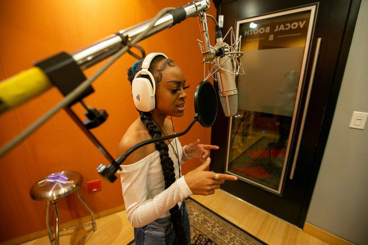 Jordyn Powell, better known as Jaiimoni Starr, runs through a song in the recording studio at Shock City Studios in St. Louis.   A viral Tik Tok video laid the foundation for the East St. Louis native’s budding rap career.