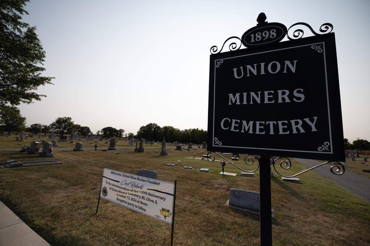 Outside of the Union Miners Cemetery in Mount Olive, Ill. Near the entrance sits a sign advertising an imminent visit from Cecil Roberts, current president of the United Mine Workers, and whose grand parents both worked and died as union miners.