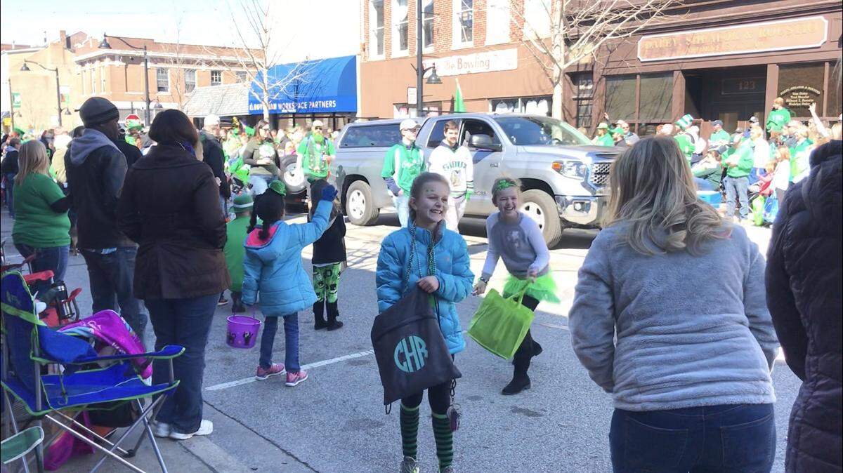 Children grabbed candy and strings of beads thrown from the floats at the Ancient Order of the Hibernian’s St. Patrick’s Day Parade Saturday, March 16, 2019, on Belleville’s Main Street.