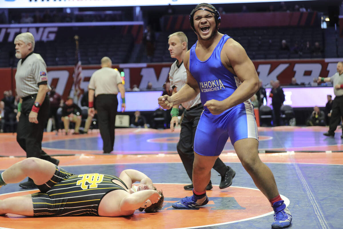 Cahokia’s Jason Dowell celebrates after pinning Reed-Custer’s Gunnar Berg in the third place match at the 2023 IHSA Individual Wrestling State Finals on Saturday.