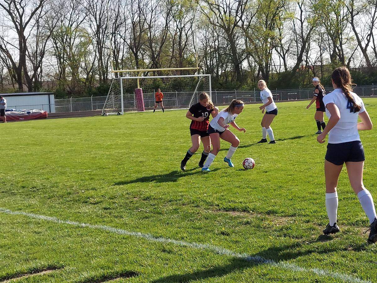 Highland freshman midfielder/striker Payton Beard marks a Mater Dei forward at the Lady Bulldogs’ end of the field as Mater Dei’s Emma Eversgerd looks to assist during a non-conference game Wednesday, April 27. Highland ultimately lost 4-0.