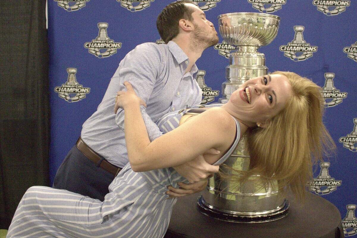 Michael Spangler and Amie Hunt pose for a photo they sent last fall to friends and family with a “save-the-date” notice for their wedding. Spangler is a season ticket sales rep for the St. Louis Blues.