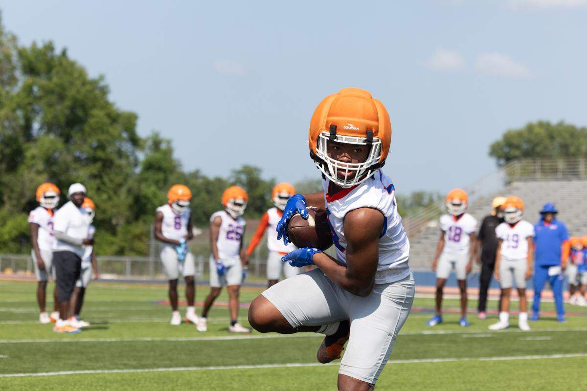 Myson Johnson-Cook runs drills during the first day of football practice for the 2025 season. Johnson-Cook is a junior running back, recently transferred to East St. Louis and is one of the top ranked high school running backs in the nation.