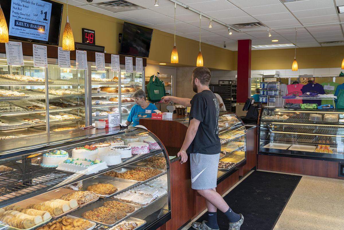 A customer at Kruta’s Bakery in Collinsville selects a pastry Aug. 13. Kruta’s is celebrating its 100th year as a family-owned business.