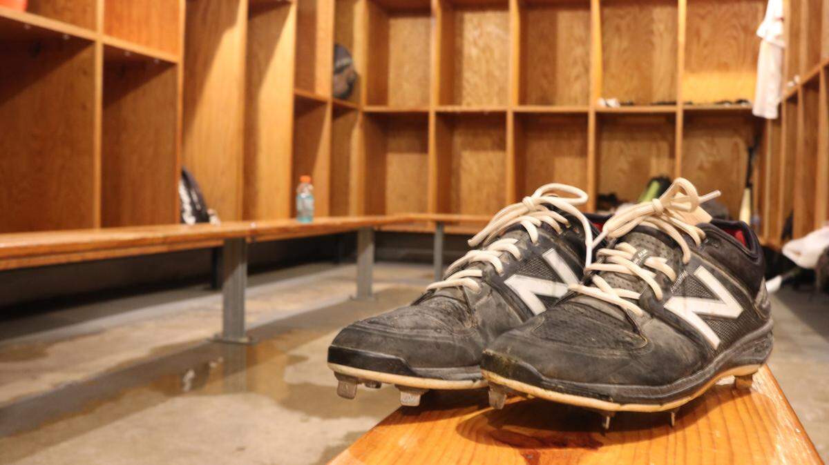 A pair of cleats sit in the football stadium locker rooms at Highland High School.