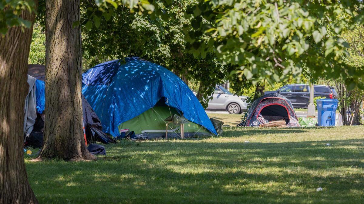 Several tents sit just off of Lake Shore Drive in Chicago’s Uptown neighborhood, in a park known for its homeless encampments. 