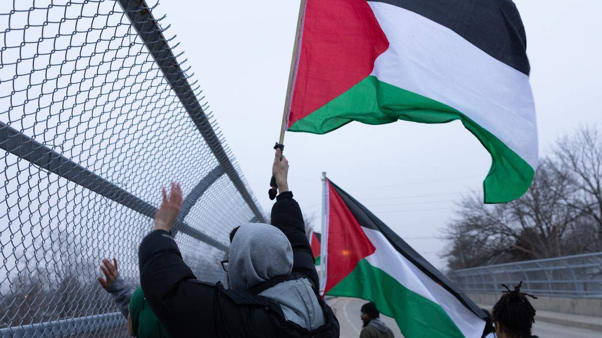 Demonstrators took to the Bunkum Road bridge over I-64 in Fairview Heights on Friday, Feb. 2, 2024, to protest the ongoing conflict in Gaza.