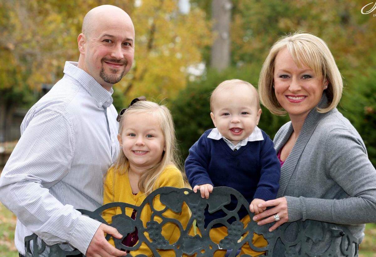 Rachel Budko, right, poses for a family portrait with husband Mike, daughter Alaina, 3, and son Michael, 17 months. The couple met at a destination wedding in Mexico.
