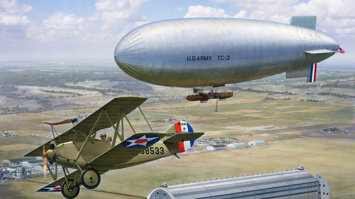 This is a Stu Shepherd print commissioned by Mark Wilderman, 375th Air Mobility Wing historian, showing the first in flight linkup between an airplane and airship over Scott Field on Dec. 15, 1924.