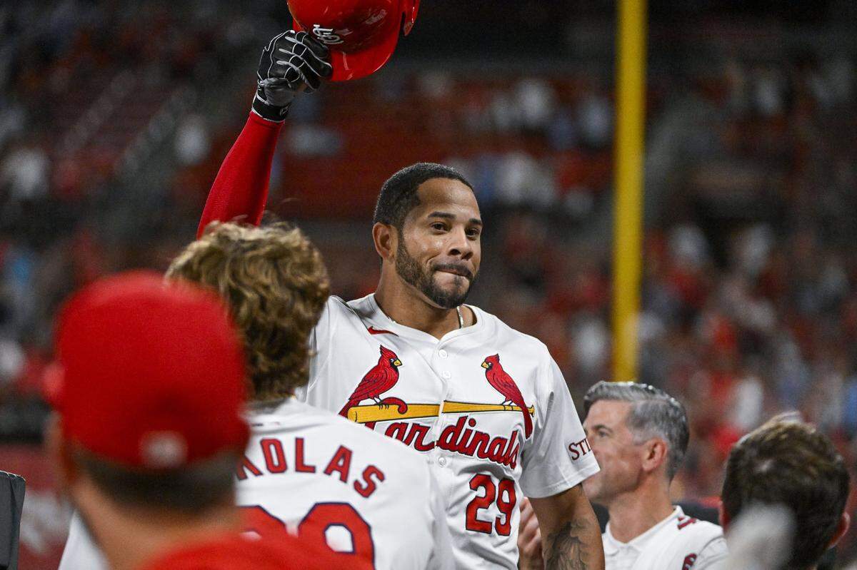 Jul 30, 2024; St. Louis, Missouri, USA;  St. Louis Cardinals pinch hitter Tommy Pham (29) salutes the fans as he receives a curtain call after hitting a grand slam home run against the Texas Rangers during the fifth inning at Busch Stadium. Mandatory Credit: Jeff Curry-USA TODAY Sports