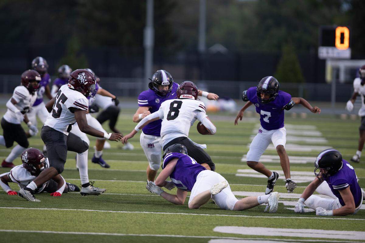 Belleville West sophomore Caiden Capell breaks through the defensive line during the first game of the season against on Aug. 30, 2024.