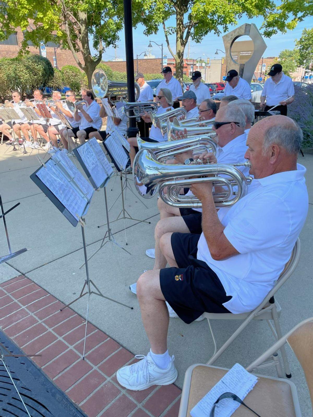 The Black Knights Alumni Association — spearheaded by Craig Brethauer, pictured — came up with the idea for a memorial recognizing the three Belleville drum and bugle corps: the Black Knights, the Bellettes and the Gabrielettes. On Saturday morning, more than 200 people gathered downtown to dedicate the memorial.
