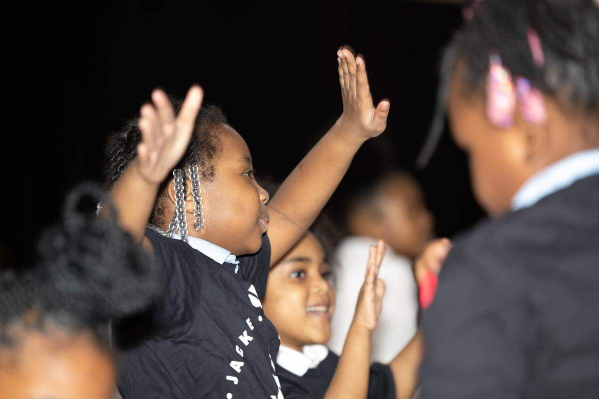 Due to an issue with a high school bus, an event at the Jackie Joyner-Kersee Center for Women and Girls in Sports Day was delayed. The first hour, in turn, was a big dance party and “hype session” for middle and elementary school students.