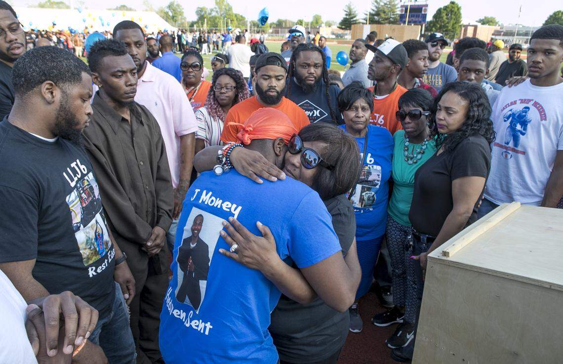 A crowd gathers to support Sukeena Gunner, mother of Jaylon McKenzie, during a vigil after his shooting death in 2019.