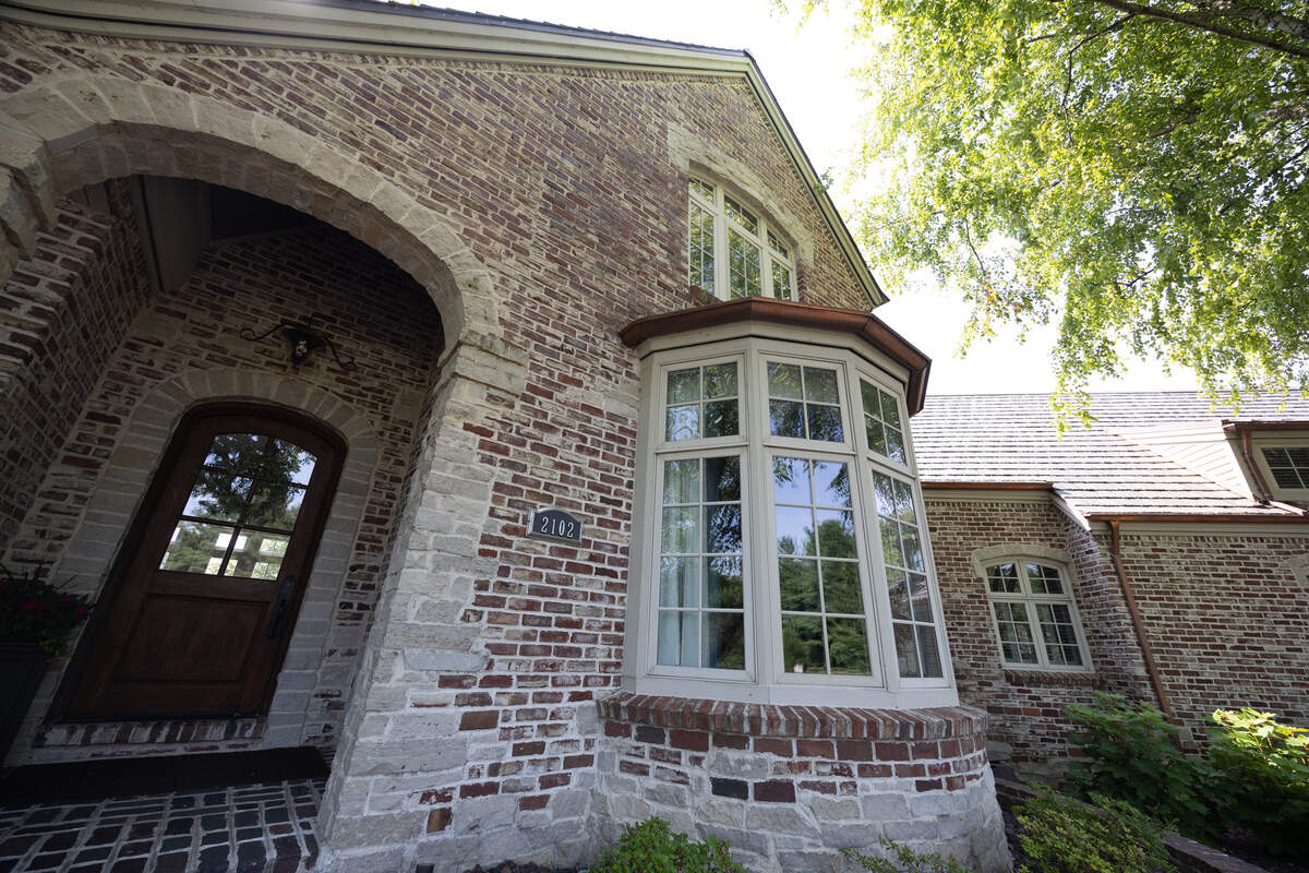 The front of the home at 2102 Clairmont Drive has hints of Tudor and Mediterranean in its architecture. There are many entrances to the home, and each one is as inviting as the last.