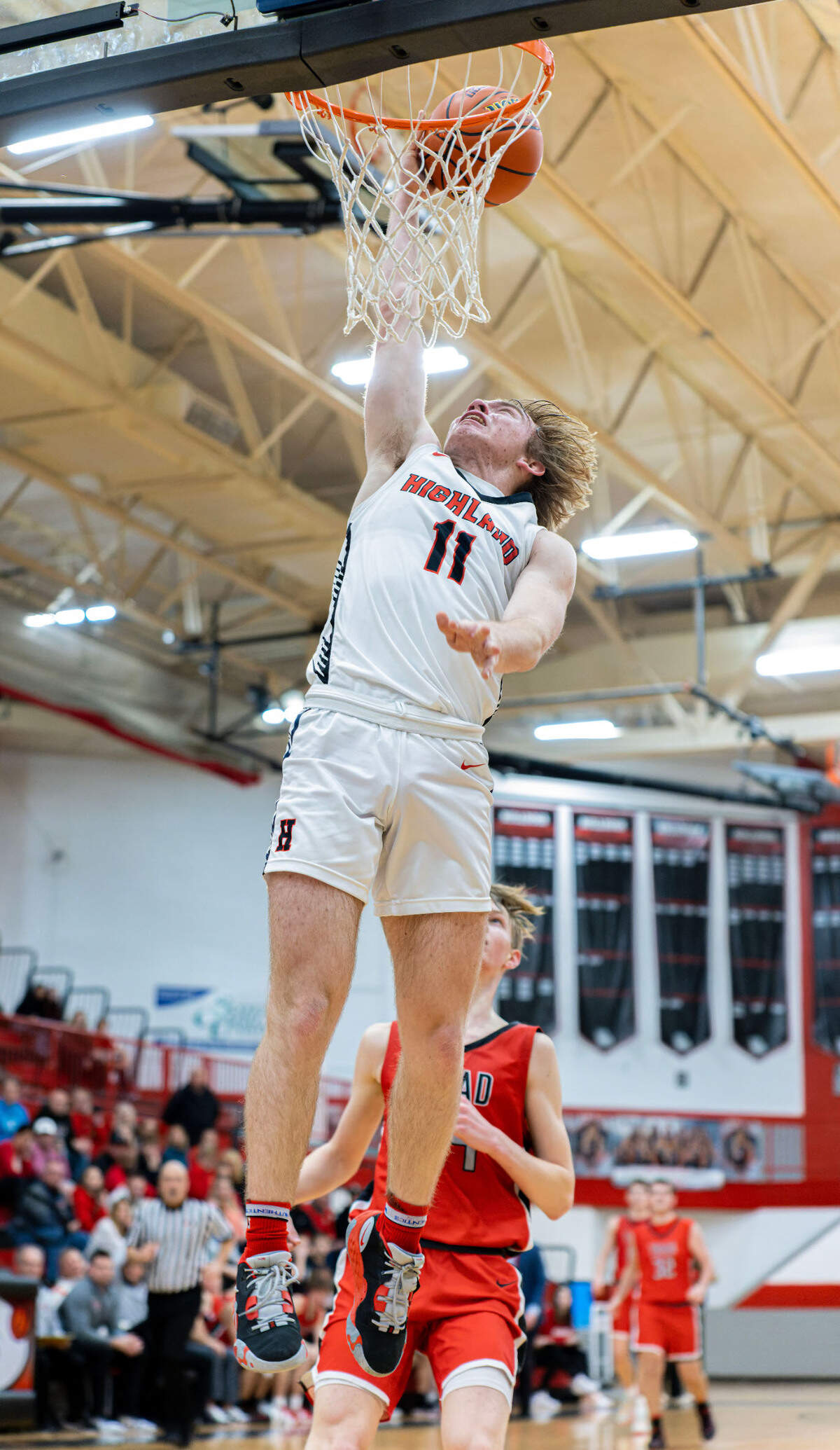 Highland’s Jake Ottensmeier lays the ball up during Friday night’s Mississippi Valley Conference game against Triad. The Knights ultimately posted a 50-37 victory.