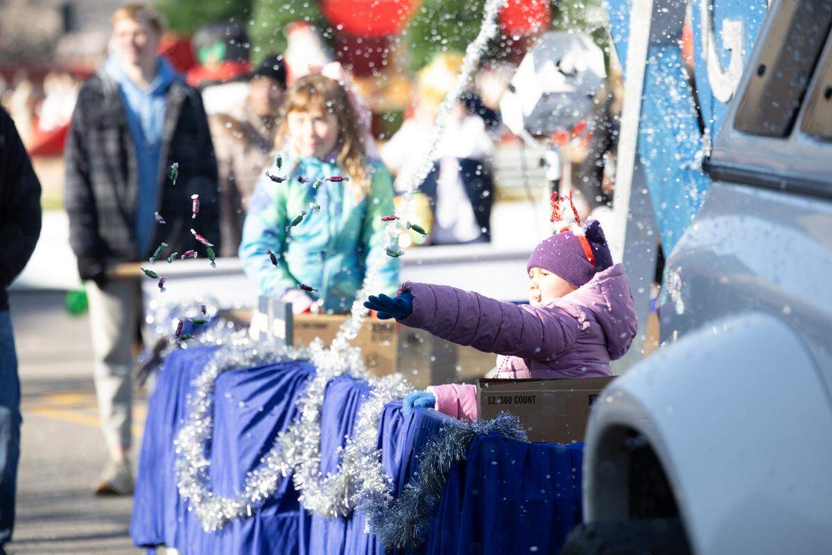 Even the youngest float-riders tossed candy during the 2025 annual Santa Parade.