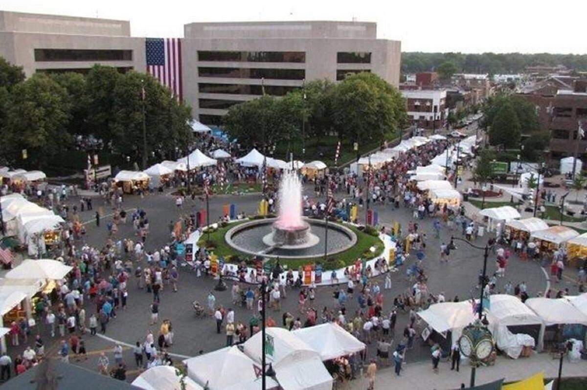 This file photo shows the familiar white tents and food booths for Art on the Square circling the fountain and lining streets in downtown Belleville.