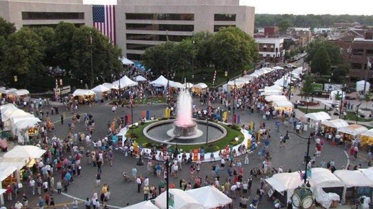 This file photo shows the familiar white tents and food booths for Art on the Square circling the fountain and lining side streets in downtown Belleville. The festival is celebrating its 20th anniversary this weekend.
