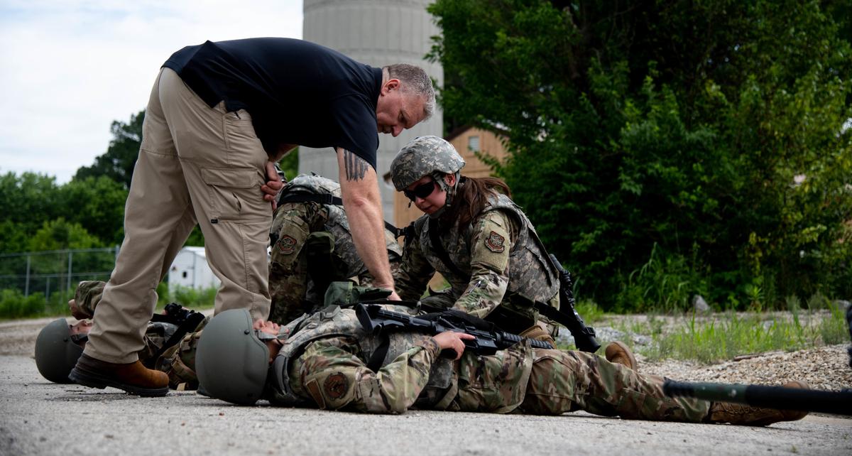 Clyde Nobles, 375th Medical Group unit deployment manager, oversees Airmen from the 375th Air Mobility Wing during a Tactical Combat Casualty Care training module during the Warrior Airmen Readiness program in the cantonment area on Scott Air Force Base. Airmen from across the wing were selected to participate in the new WAR Program that has a focus on life saving, care under fire, and small team tactics in a safe controlled environment.