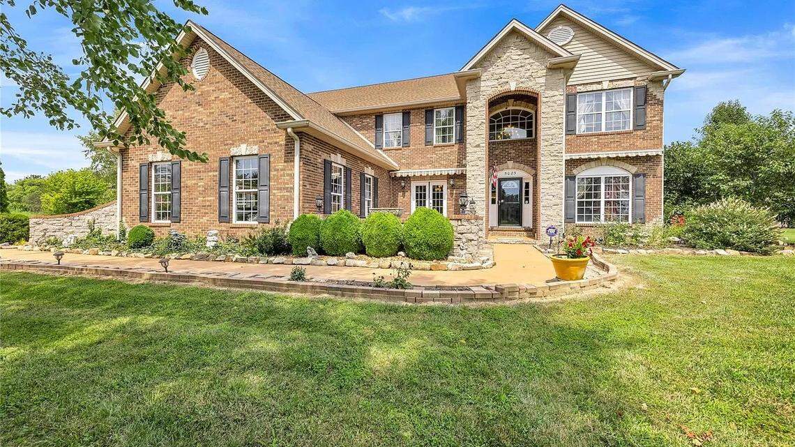 This luxury $900K metro-east home offers a pool, sauna and more. Take a peek inside