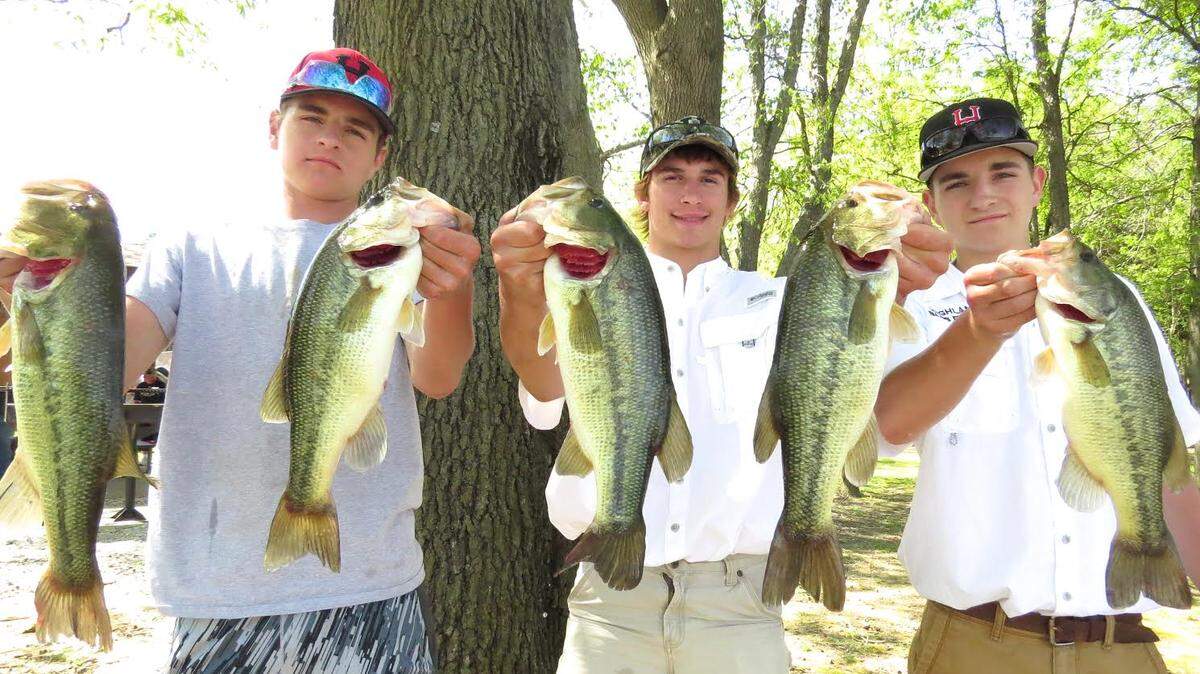 From left, Gage Bircher, Colton Brown and Zane Bircher hold up their fish that helped them win the IHSA Coffeen Lake Sectional on Monday, May 7 with a five-fish limit of 14.32 pounds.